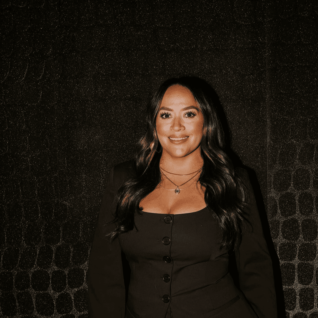 Portrait of Janine, a professional stylist at Solo Salon, showcasing their expertise and style.