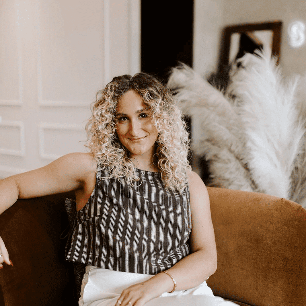 Portrait of Miley, a professional stylist at Solo Salon, showcasing their expertise and style.