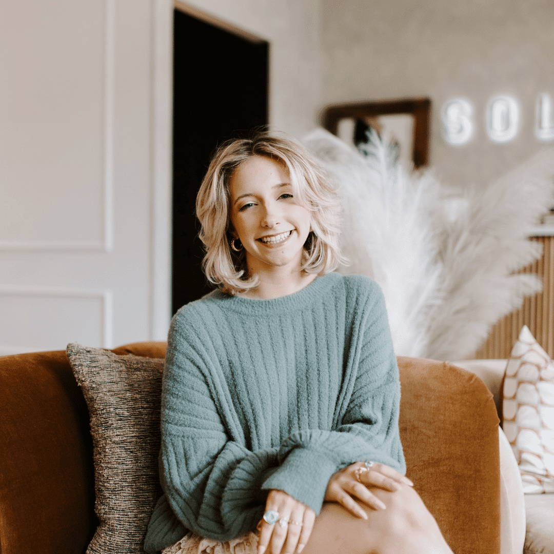 Portrait of Olivia, a professional stylist at Solo Salon, showcasing their expertise and style.