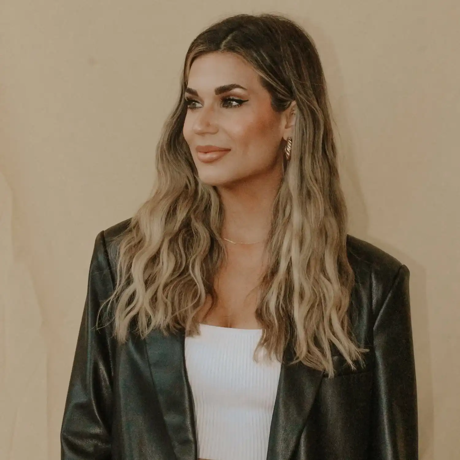 Portrait of Alyssa, a professional stylist at Solo Salon, showcasing their expertise and style.