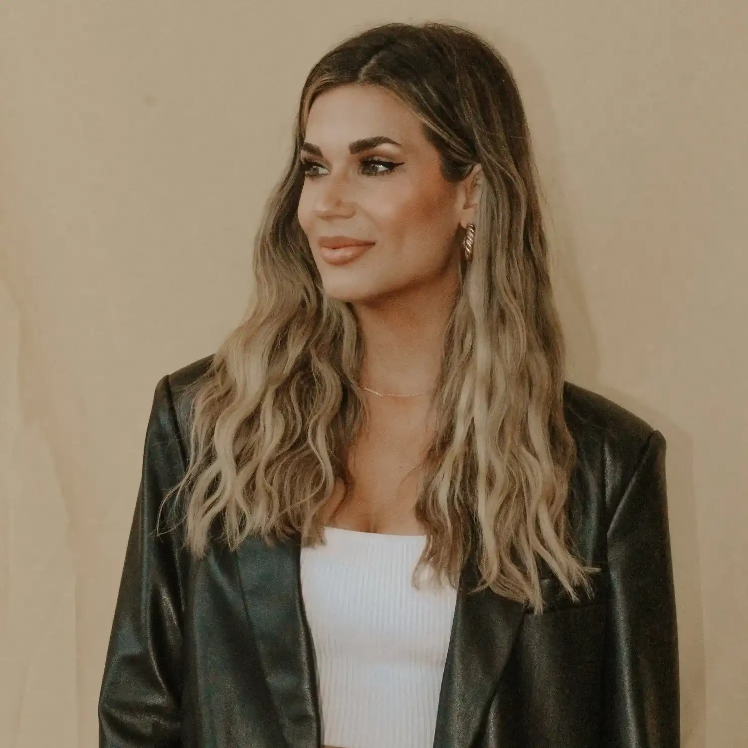 Portrait of Alyssa, a professional stylist at Solo Salon, showcasing their expertise and style.