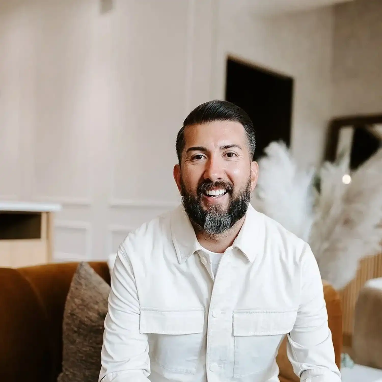 Portrait of David, a professional stylist at Solo Salon, showcasing their expertise and style.